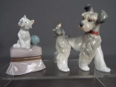 Lladro - Two Lladro figurines comprising 'My Favourite Companion' # 6985 depicting a terrier seated