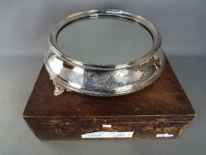 A good quality silver plate wedding cake stand of circular form,