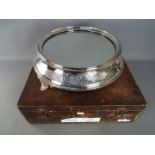 A good quality silver plate wedding cake stand of circular form,