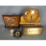 Three mantel clocks, a barometer and a desk thermometer.