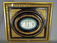 A framed Victorian oval tile,