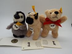 Steiff - a Steiff Penguin entitled Lari with tag, button and yellow label in wing,