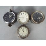 Two Smiths car dashboard clocks and two similar.