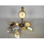 A collection of travel clocks to include and Ebel and two modern pocket watches.