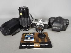 Photography - An Olympus OM1 camera with OM-System F.