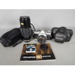 Photography - An Olympus OM1 camera with OM-System F.
