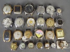 A varied collection of lady's and gentleman's watch heads.