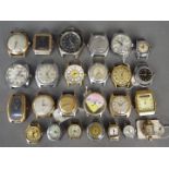 A varied collection of lady's and gentleman's watch heads.