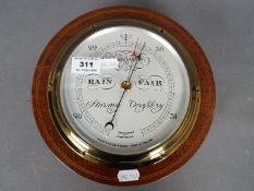 A good quality Short & Mason, London compensated, mahogany cased barometer of circular form,
