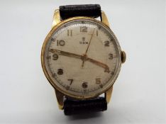A 9ct gold cased gentleman's Tudor wristwatch, raised Arabic numerals to a white dial,
