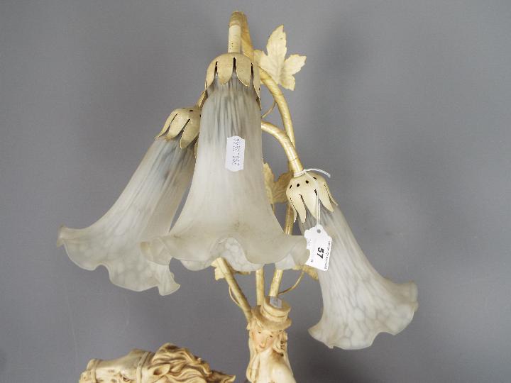 A decorative three stem table lamp in the form of a lady on horseback, - Image 3 of 3