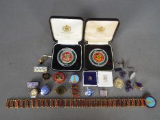 A small collection of pin badges, lapel badges, medallions, cufflinks and similar,