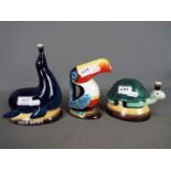 Breweriana - a Guinness ceramic jug in the form of a toucan and two money banks,