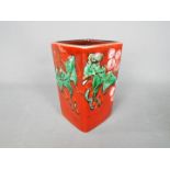 An Anita Harris holly and berries vase, approx height 11.