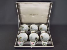 Royal Worcester - A cased Royal Worcester coffee service comprising six saucers and six coffee cans,