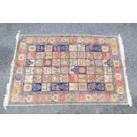 A good quality silk carpet measuring approximately 149 cm x 230 cm.