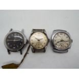 Three military style watch heads,