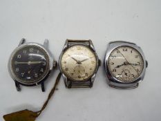 Three military style watch heads,