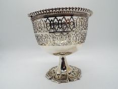 A silver plate pedestal bowl with pierced decoration and swing handle, Mappin, standing 11.