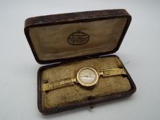 A lady's 9ct gold cased wristwatch, Arabic numerals to the dial marked 'Bateman's St Helens',