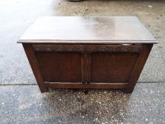 A linen chest with carved decoration, approximately 57 cm x 90 cm x 46 cm.