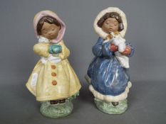 Lladro - Two Lladro gres figurines depicting young girls with pets comprising 'Hold Me Tight' #