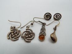 Two pairs of silver earrings plus 2 single silver earrings all marked 925, total weight approx 7.