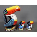 Breweriana - a Guinness Toucan money bank, 21 cm (h) and a pair of salt and pepper shakers.