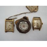 A lady's Swiss silver cased fob watch (.800 fineness) and two Bulova watch heads.