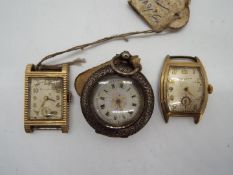 A lady's Swiss silver cased fob watch (.800 fineness) and two Bulova watch heads.