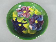 Moorcroft - a Moorcroft bowl decorated in the clematis pattern approximately 21.