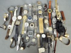 A quantity of lady's and gentleman's wristwatches.