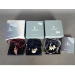 Lladro - Three boxed Lladro necklace pendants comprising 'Wisdom', 'Leader' and 'Onwards'.