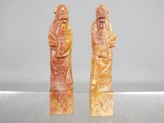 Two soapstone carvings depicting a scholar, each approximately 9.5 cm (h).