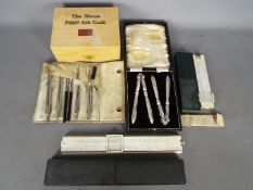 A vintage Boots Pure Drug Co Home First Aid Case (with contents), technical drawing set,