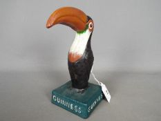 Breweriana - a cast iron model in the form of a toucan, marked 'Guinness', approximately 20 cm (h).