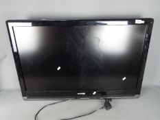 A 37" Toshiba LCD television, model number 37XV503d, no stand or remote.