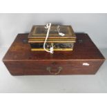 A mahogany box / chest with hinge lid approximately 20 cm x 74 cm x 39 cm and a Milners Safe Comany