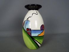 Lorna Bailey - a Lorna Bailey vase decorated with an Art Deco house,