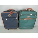 Two pieces of travel luggage including one by Carlton International.