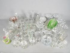 A quantity of mixed glassware to include uranium glass, branded whisky tumblers, dishes and similar.
