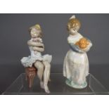 Lladro - Two Lladro figurines comprising 'First Performance' # 6763 and 'Valencian Girl' # 4841,