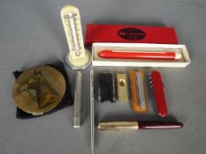 Lot to include a Parker fountain pen, propelling pencil, desk top thermometer, penknife and similar.