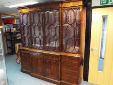 A large mahogany breakfront bookcase by Gill & Reigate, London,