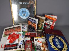 A miscellaneous box of football memorabilia including brochures and publications,