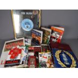 A miscellaneous box of football memorabilia including brochures and publications,