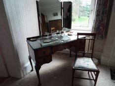 A walnut veneered dressing table on cabriole supports with triptych mirror and chair,