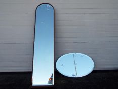 Two wall mirrors comprising an oval example (41 cm x 66 cm) and one other (130 cm x 34 cm) [2]