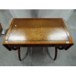 A good quality side table having twin drawers, tooled leather insert to the surface,