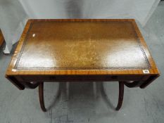 A good quality side table having twin drawers, tooled leather insert to the surface,